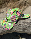 Butterfly Babe legionnaire swim hat with neck flap, worn at the beach – bright UPF50+ kids & baby sun hat by Cucumber Cool
