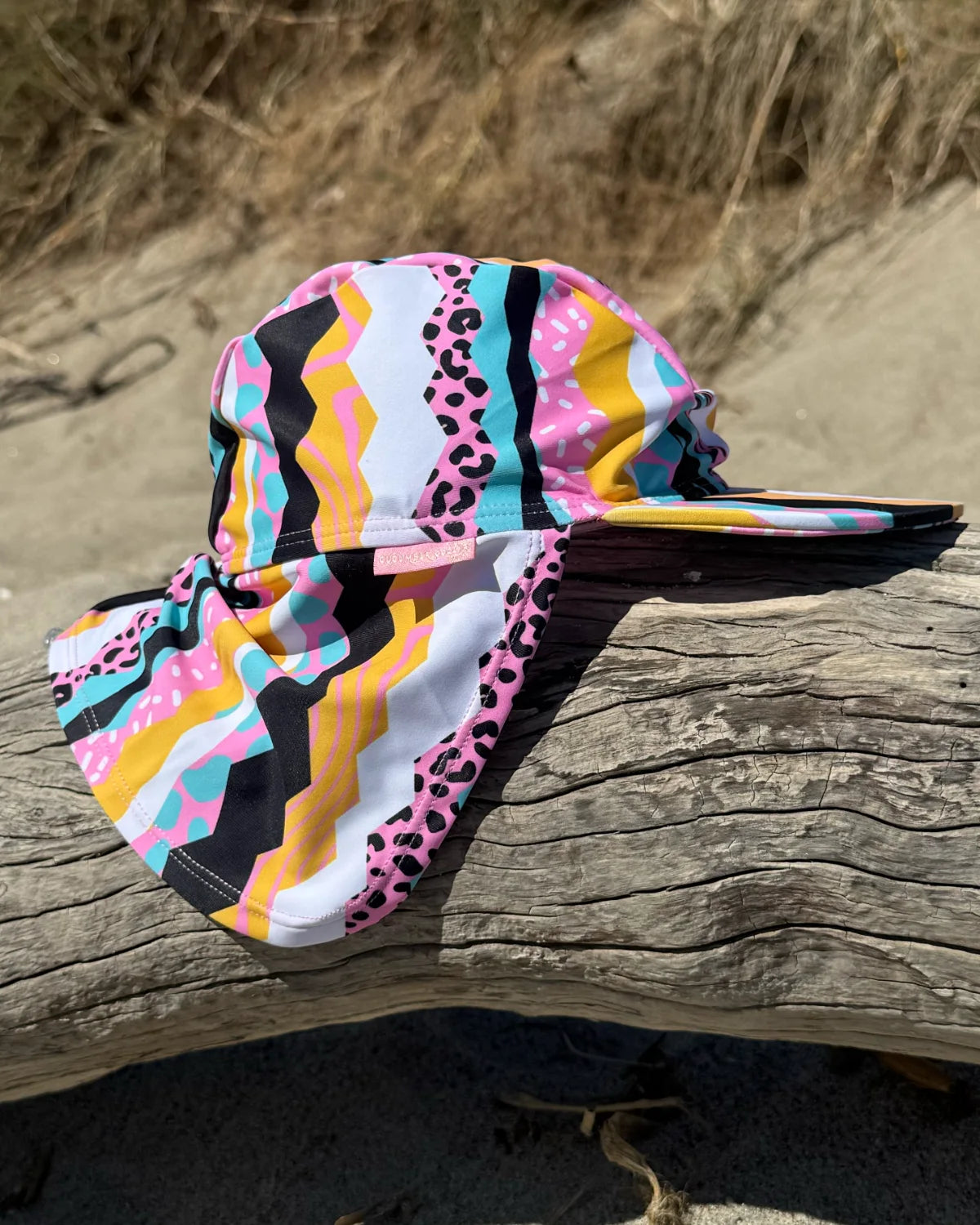 Snazzy Stripes striped legionnaire swim hat with neck flap, worn at the beach – bright UPF50+ kids & baby sun hat by Cucumber Cool
