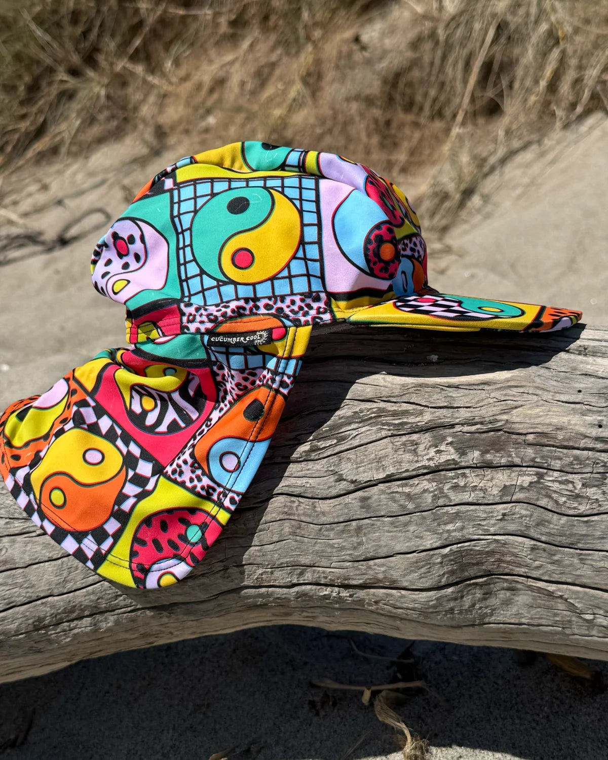 Yin Yang Yeah! legionnaire swim hat with neck flap, worn at the beach – bright UPF50+ kids & baby sun hat by Cucumber Cool
