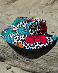 Construction Cool kids swim bucket hat with chin strap, worn at the beach – bright UPF50+ round brim beach hat by Cucumber Cool