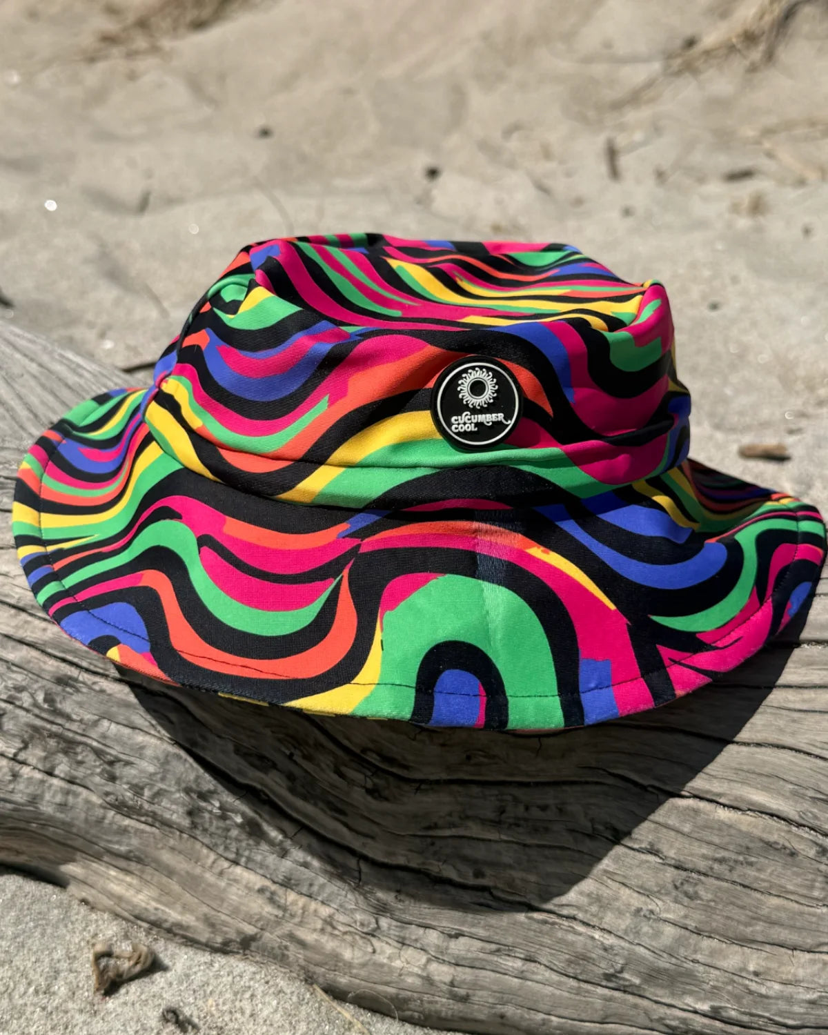 Look At Me Leopard leopard print kids swim bucket hat with chin strap, worn at the beach – bright UPF50+ round brim beach hat by Cucumber Cool