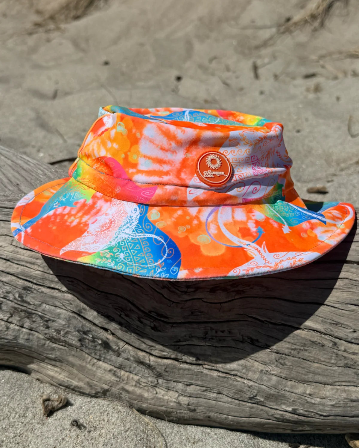 Manta Magic kids swim bucket hat with chin strap, worn at the beach – bright UPF50+ round brim beach hat by Cucumber Cool