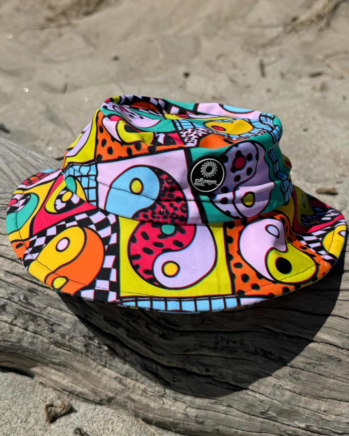 Yin Yang Yeah! kids swim bucket hat with chin strap, worn at the beach – bright UPF50+ round brim beach hat by Cucumber Cool