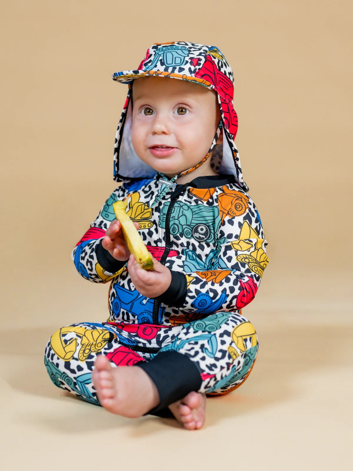Construction Cool digger print baby sunsuit with matching swim hat – bright UPF50+ long sleeve swimsuit by Cucumber Cool