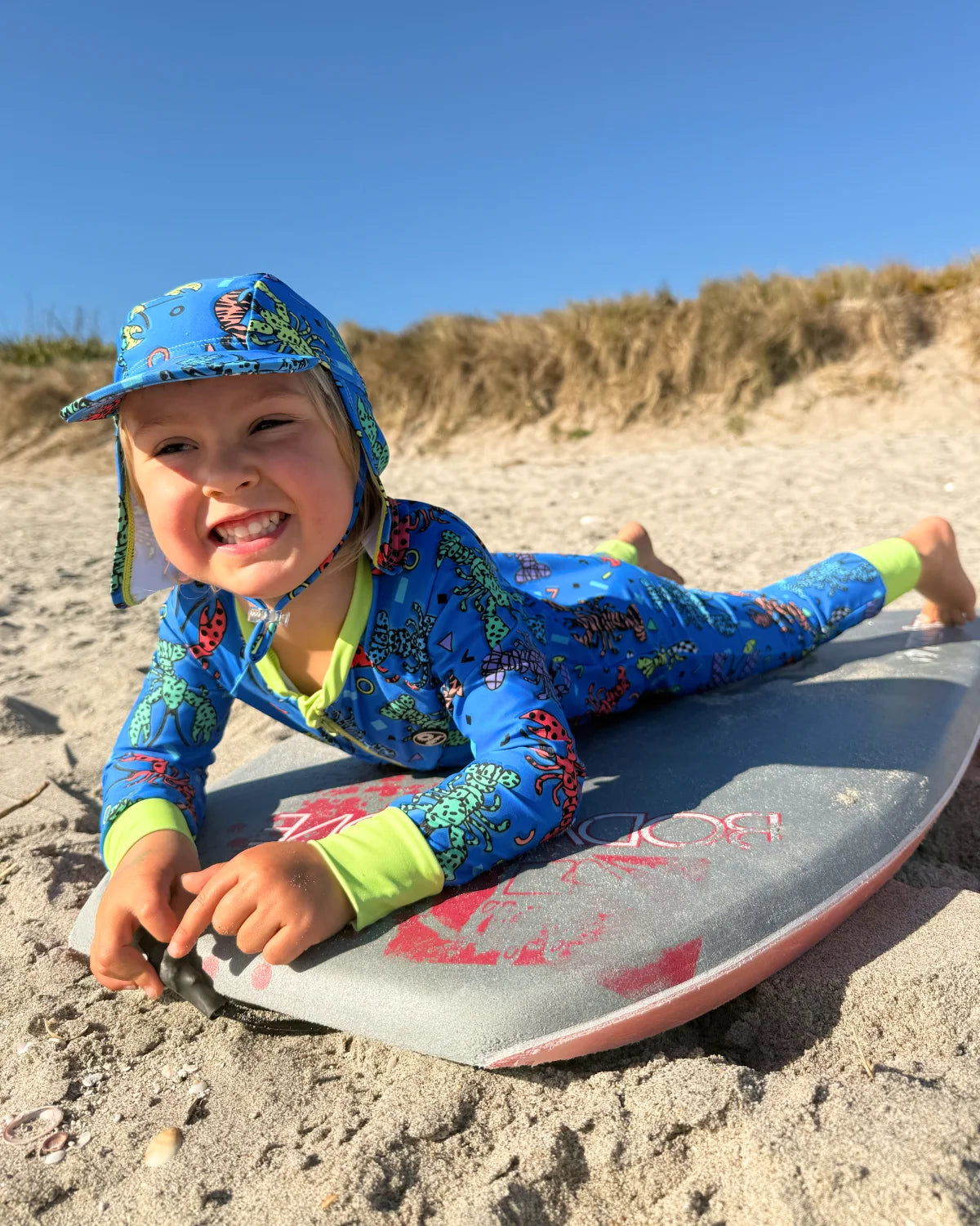Crazy Claws toddler sunsuit – bright UPF50+ long sleeve swimsuit by Cucumber Cool