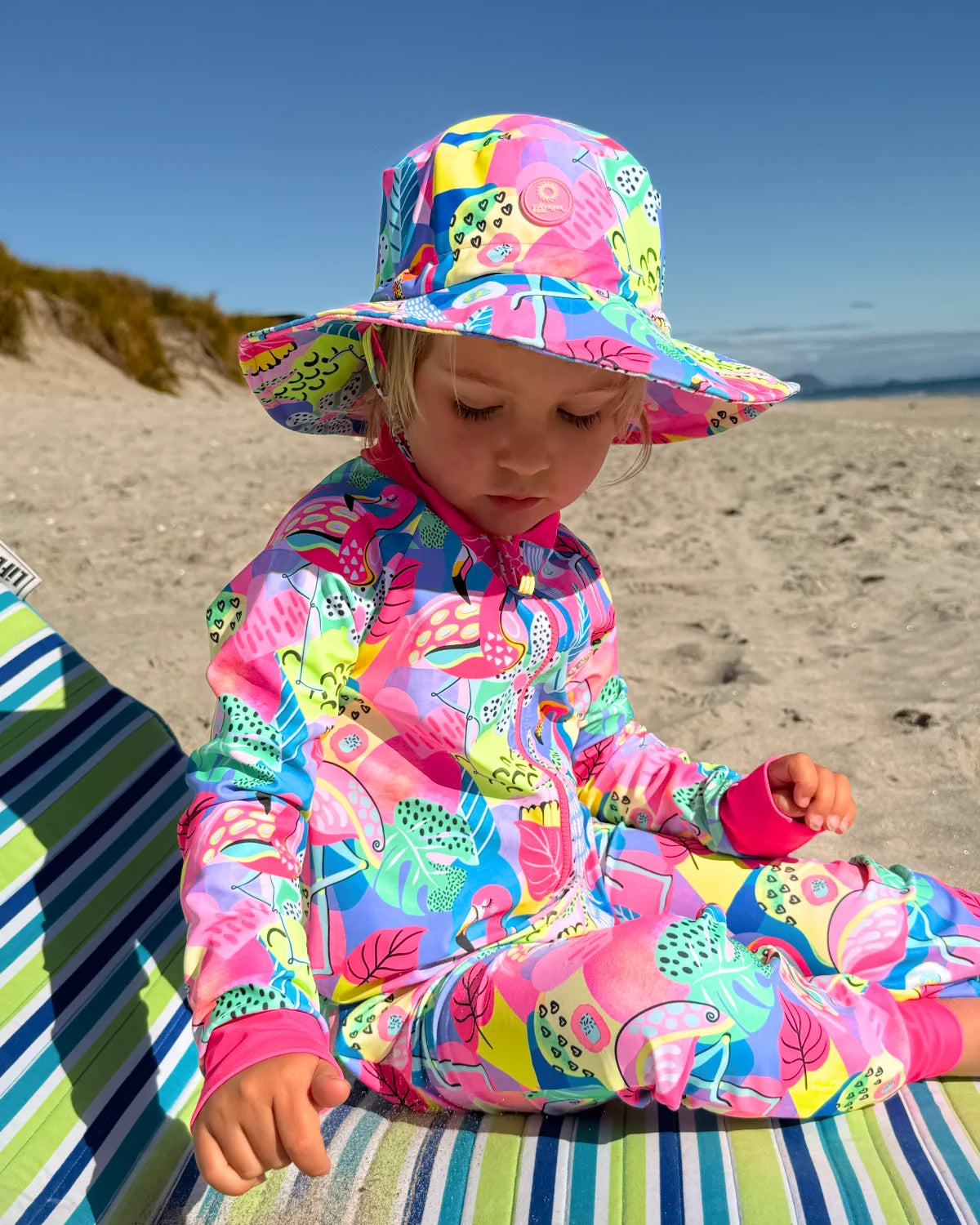 Club Tropicana tropical print toddler sunsuit – bright UPF50+ long sleeve swimsuit by Cucumber Cool