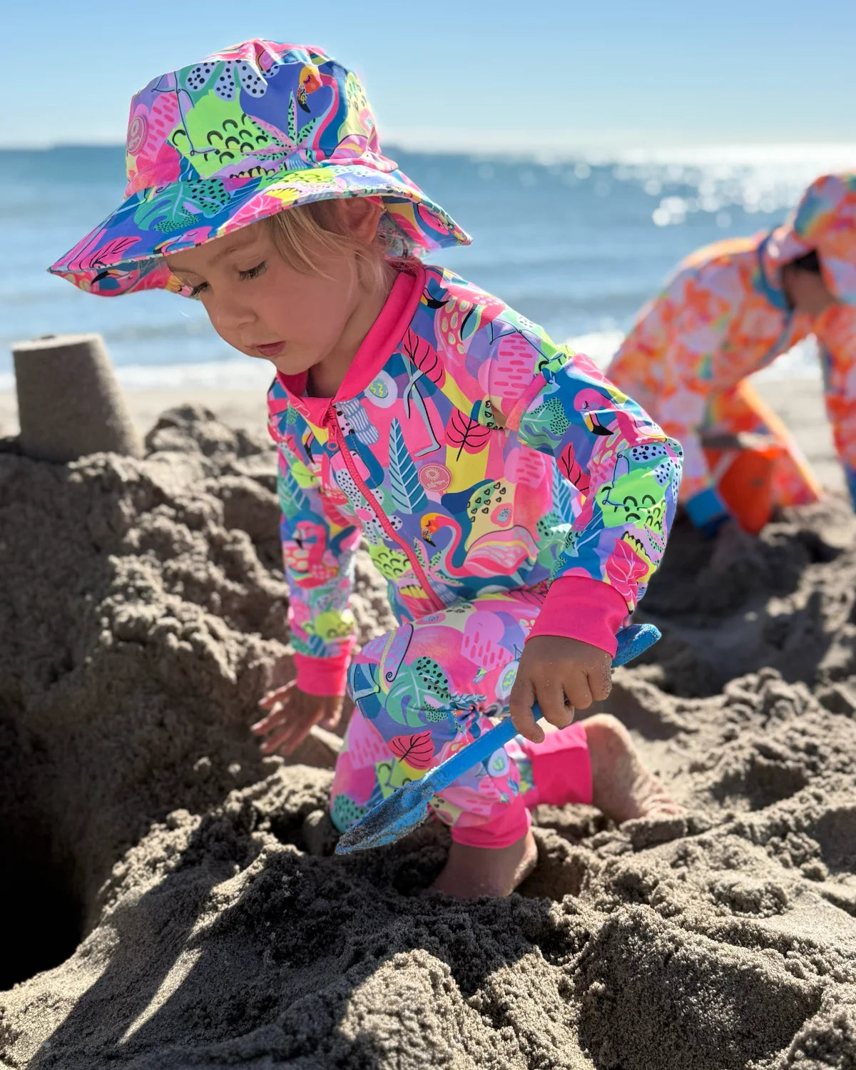 Club Tropicana tropical print toddler sunsuit, photo 2 – bright UPF50+ long sleeve swimsuit by Cucumber Cool