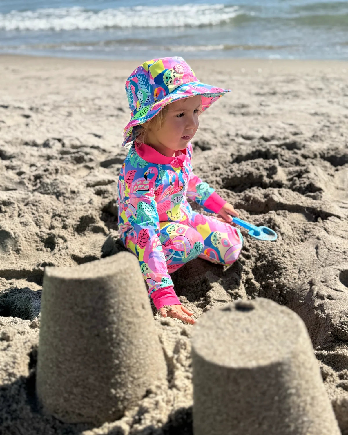 Club Tropicana tropical print baby sunsuit, photo 4 – bright UPF50+ long sleeve swimsuit by Cucumber Cool