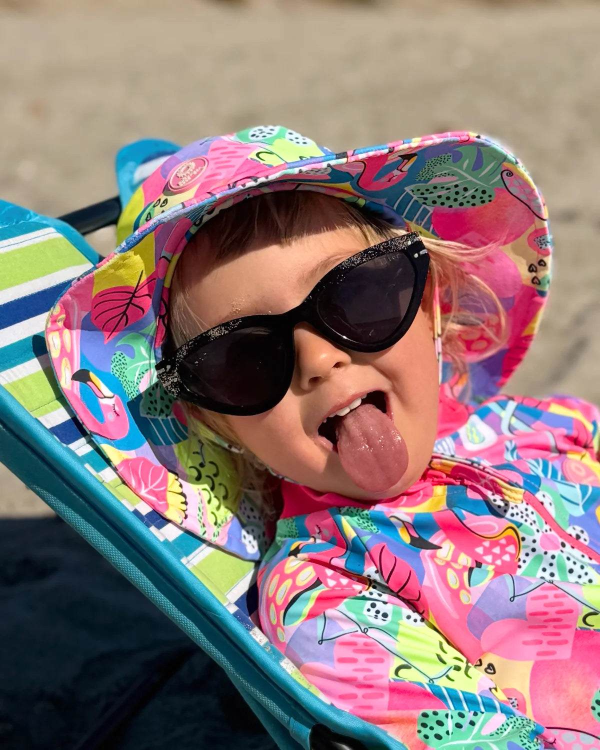Club Tropicana tropical print kids swim bucket hat with chin strap, photo 2 – bright UPF50+ round brim beach hat by Cucumber Cool