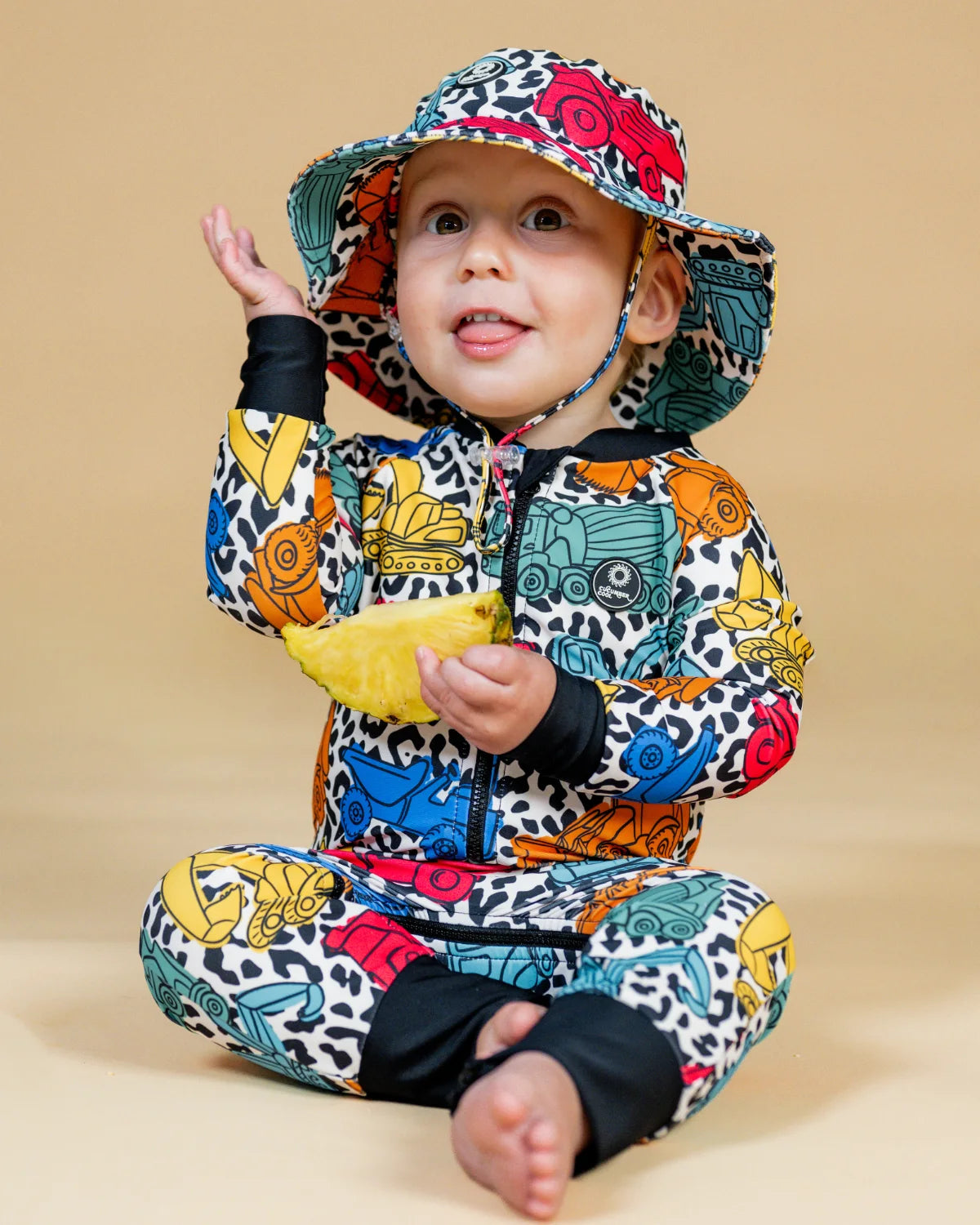 Construction Cool digger print toddler sunsuit – bright UPF50+ long sleeve swimsuit by Cucumber Cool