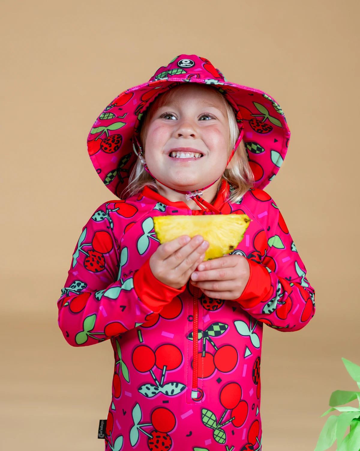 Cherry Pop kids sunsuit, photo 2 – bright UPF50+ long sleeve full coverage swimsuit by Cucumber Cool