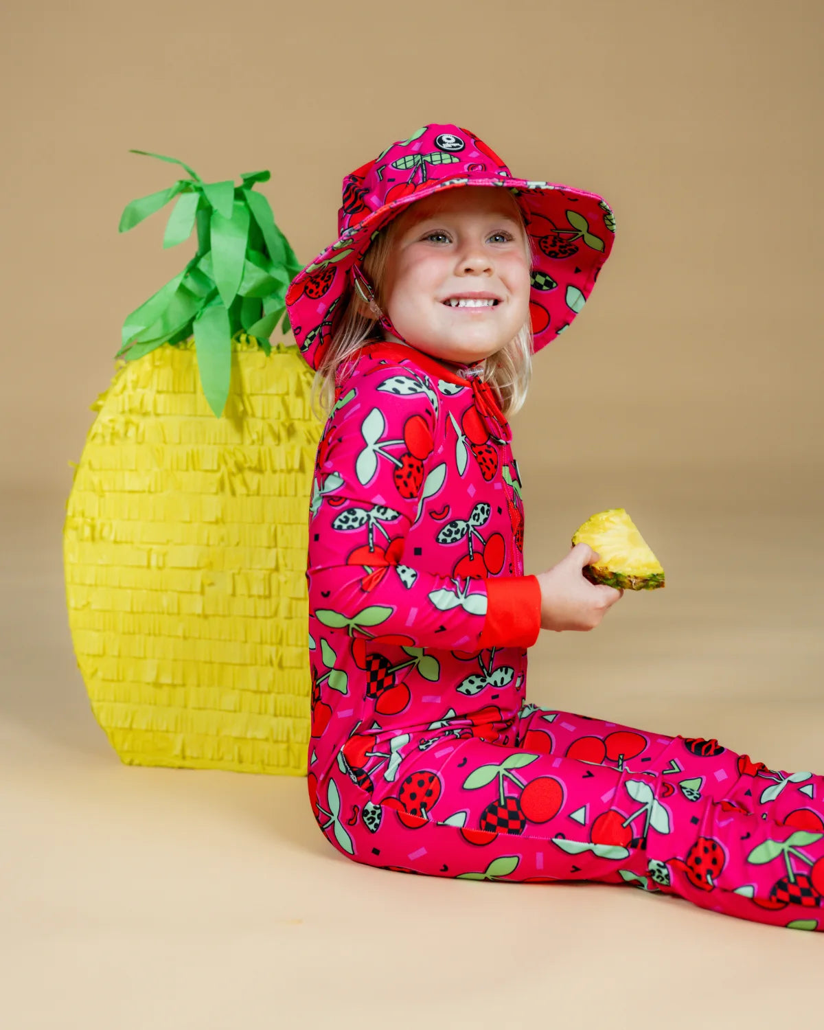 Cherry Pop kids sunsuit, photo 4 – bright UPF50+ long sleeve full coverage swimsuit by Cucumber Cool