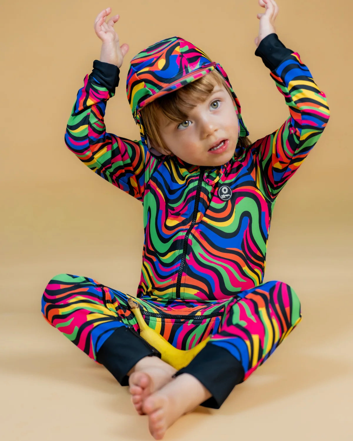 Look At Me Leopard leopard print baby sunsuit, photo 2 – bright UPF50+ long sleeve swimsuit by Cucumber Cool