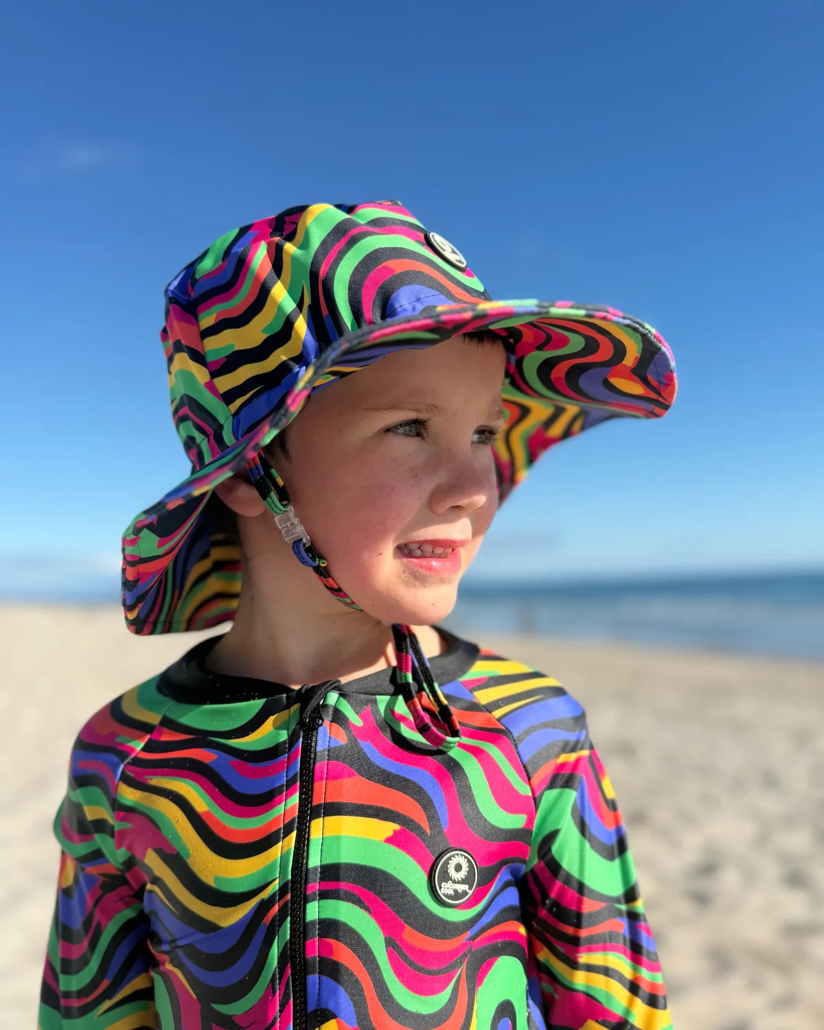 Look At Me Leopard leopard print kids swim bucket hat with chin strap, photo 2 – bright UPF50+ round brim beach hat by Cucumber Cool