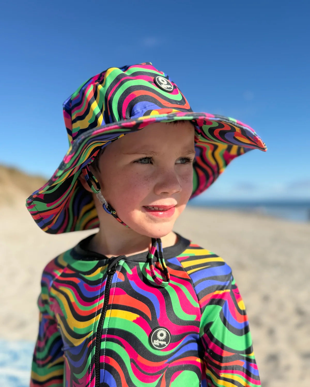 Look At Me Leopard leopard print kids swim bucket hat with chin strap – bright UPF50+ round brim beach hat by Cucumber Cool