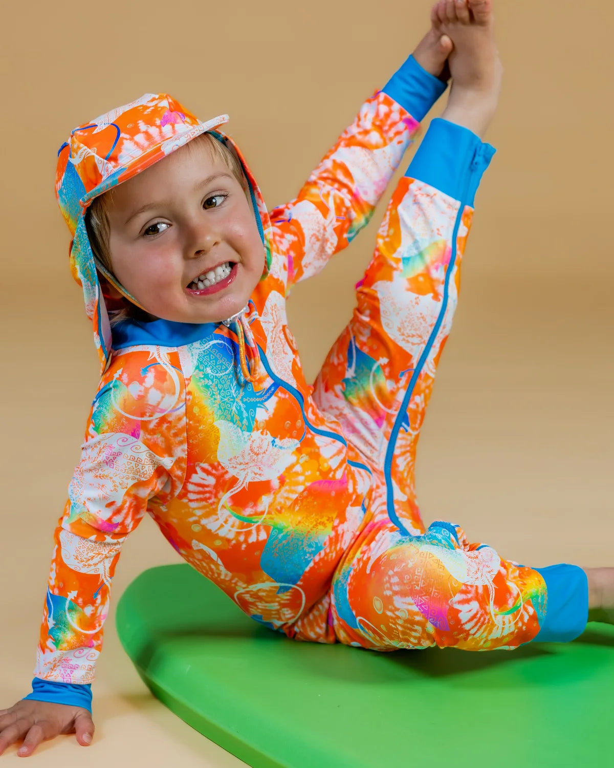 Manta Magic baby sunsuit – bright UPF50+ long sleeve swimsuit by Cucumber Cool