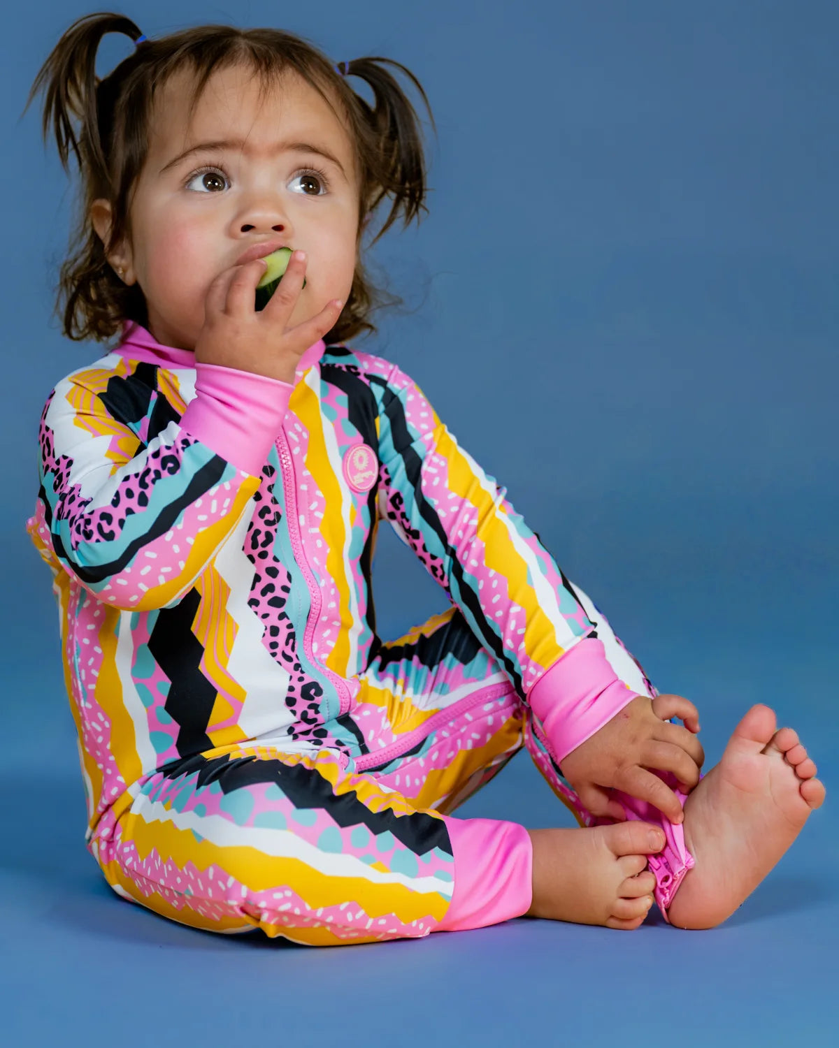 Snazzy Stripes striped toddler sunsuit, photo 2 – bright UPF50+ long sleeve swimsuit by Cucumber Cool
