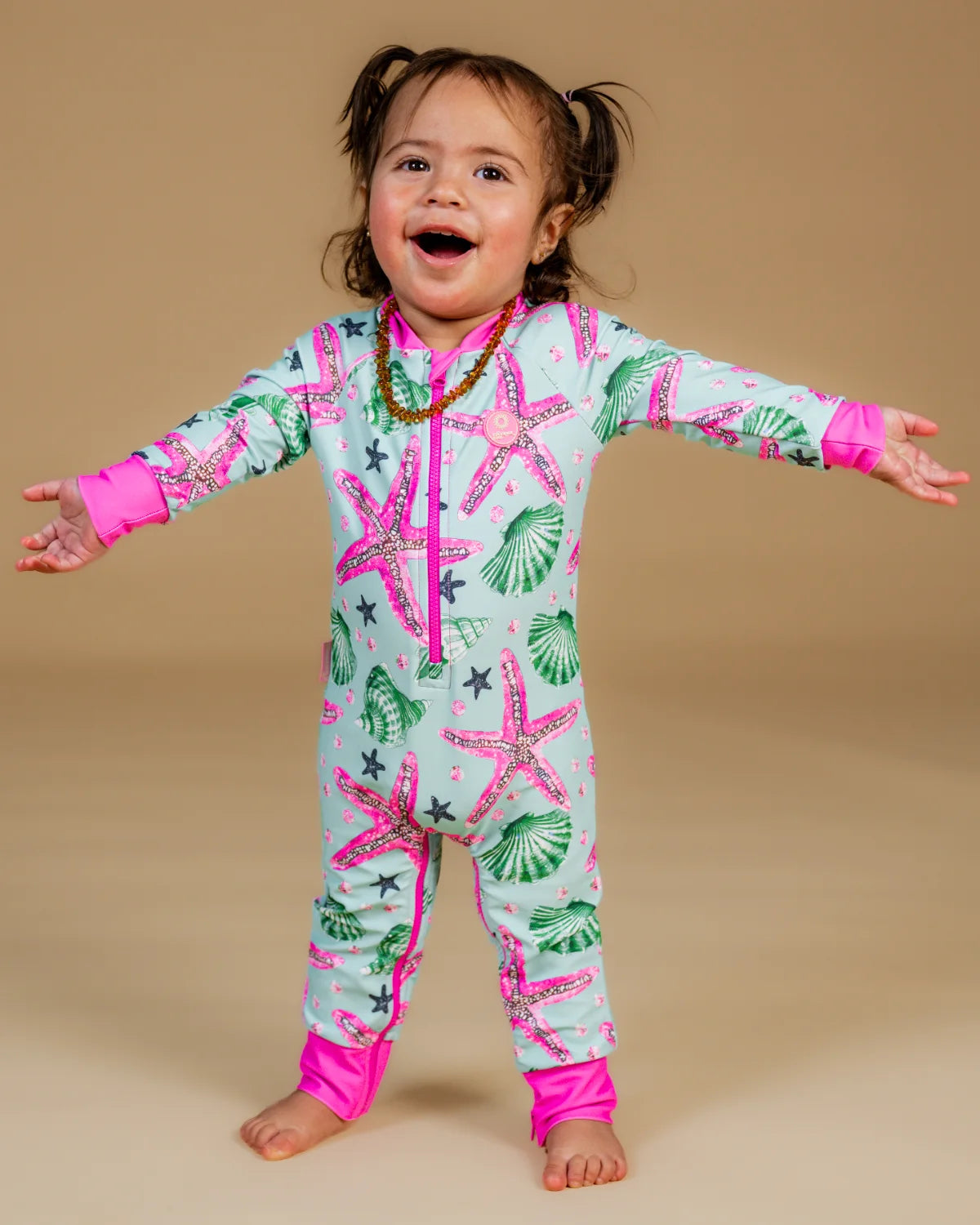 Starfish toddler sunsuit – bright UPF50+ long sleeve swimsuit by Cucumber Cool