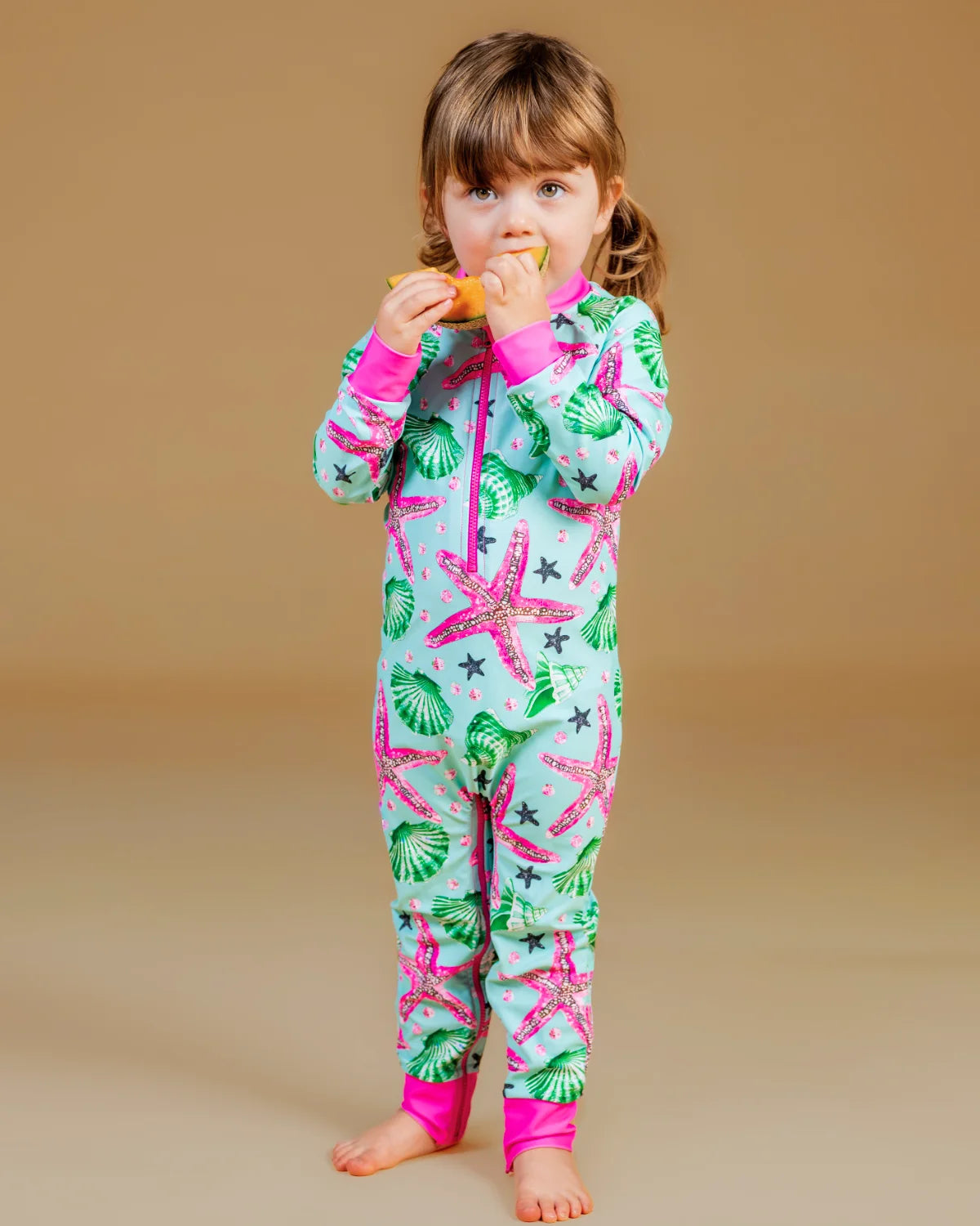 Starfish baby sunsuit, photo 2 – bright UPF50+ long sleeve swimsuit by Cucumber Cool