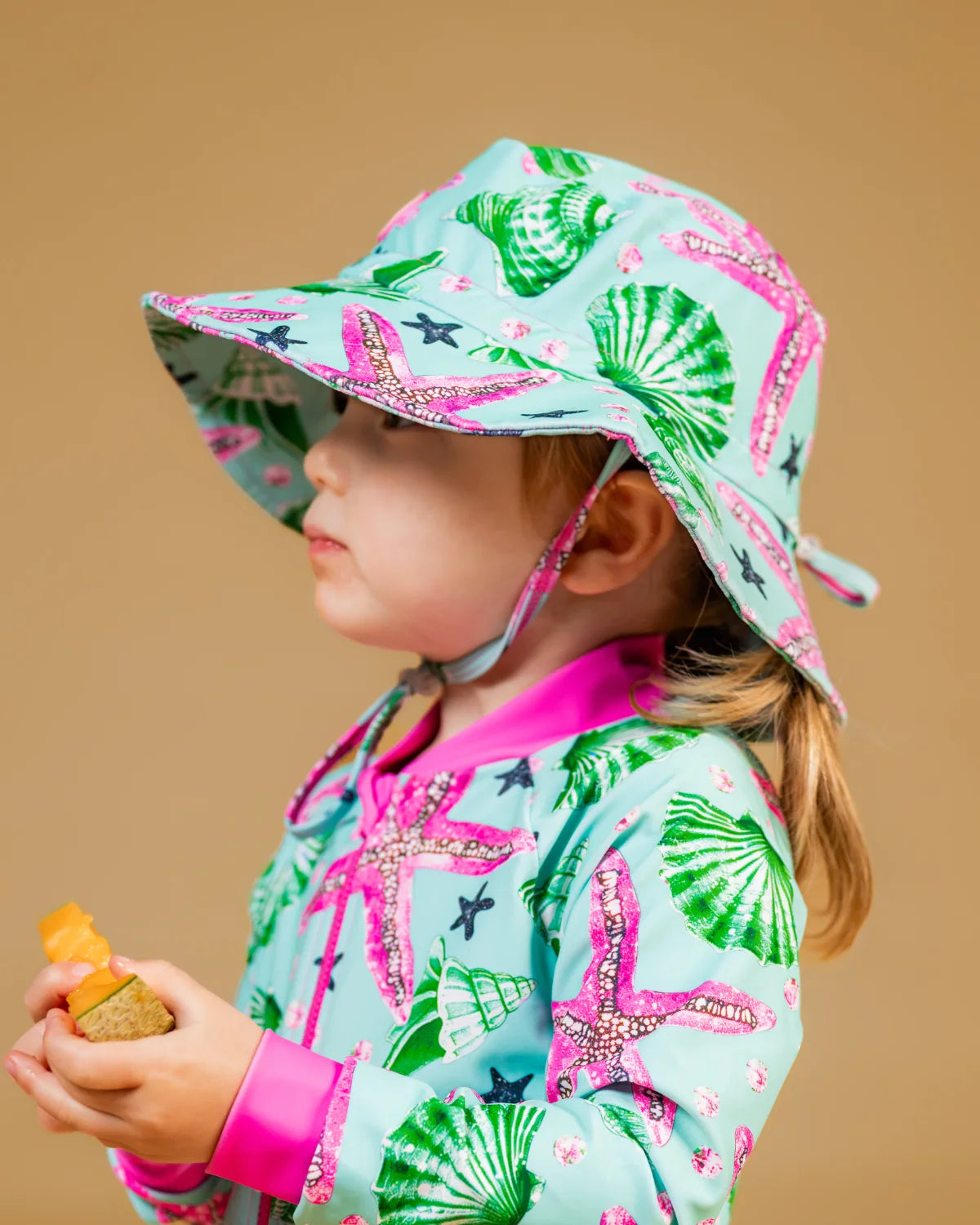 Starfish kids swim bucket hat with chin strap – bright UPF50+ round brim beach hat by Cucumber Cool