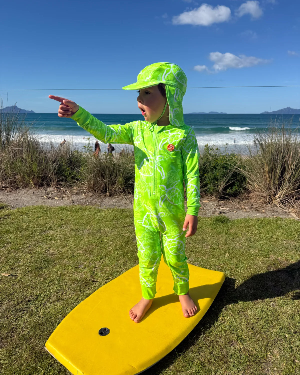 Turtle-Tastic baby sunsuit – bright UPF50+ long sleeve swimsuit by Cucumber Cool