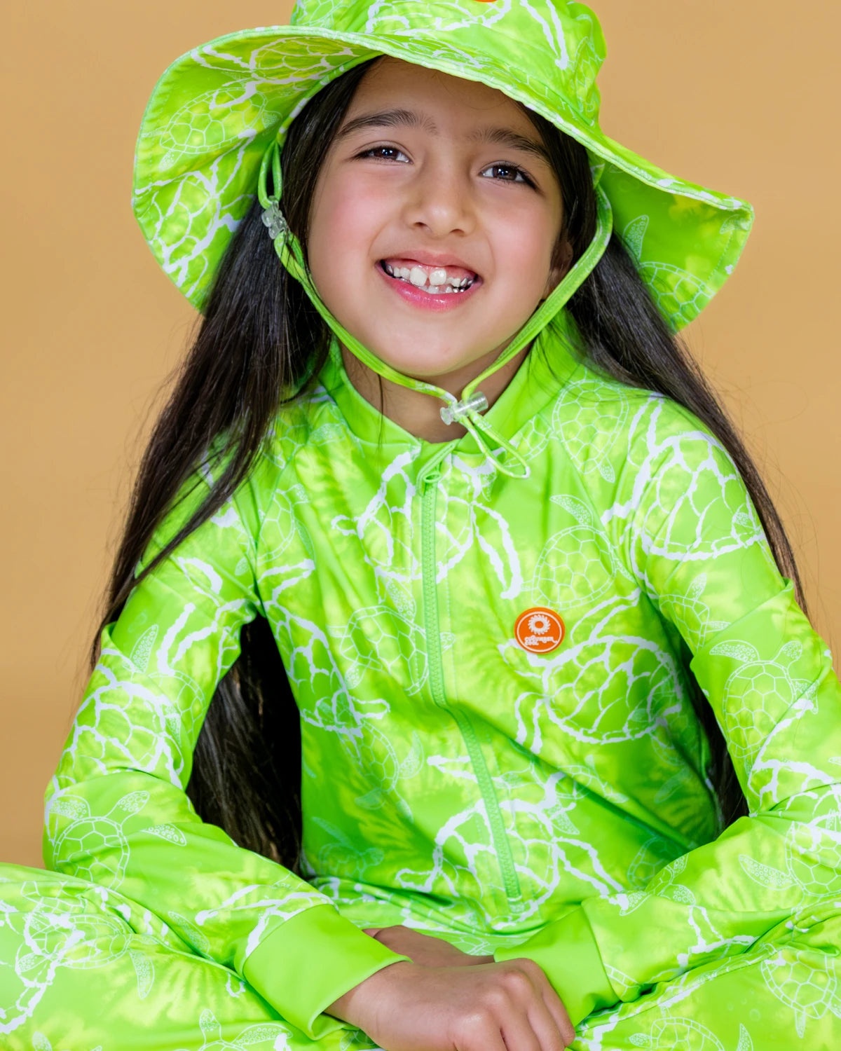 Turtle-Tastic turtle print kids sunsuit, photo 5 – bright UPF50+ long sleeve full coverage swimsuit by Cucumber Cool