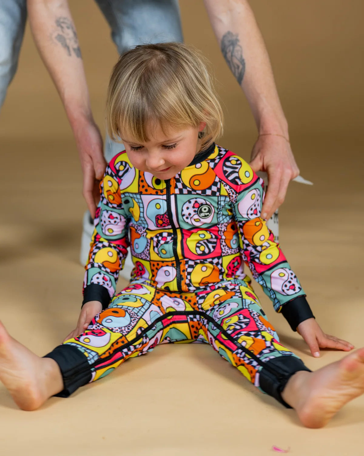 Yin Yang Yeah! toddler sunsuit, photo 4 – bright UPF50+ long sleeve swimsuit by Cucumber Cool