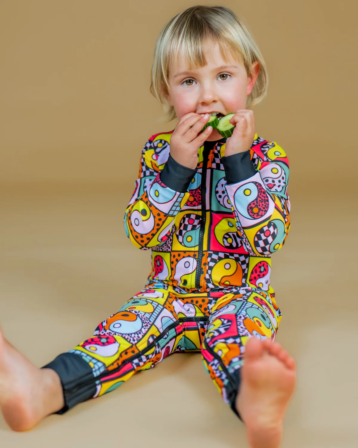 Yin Yang Yeah! baby sunsuit – bright UPF50+ long sleeve swimsuit by Cucumber Cool