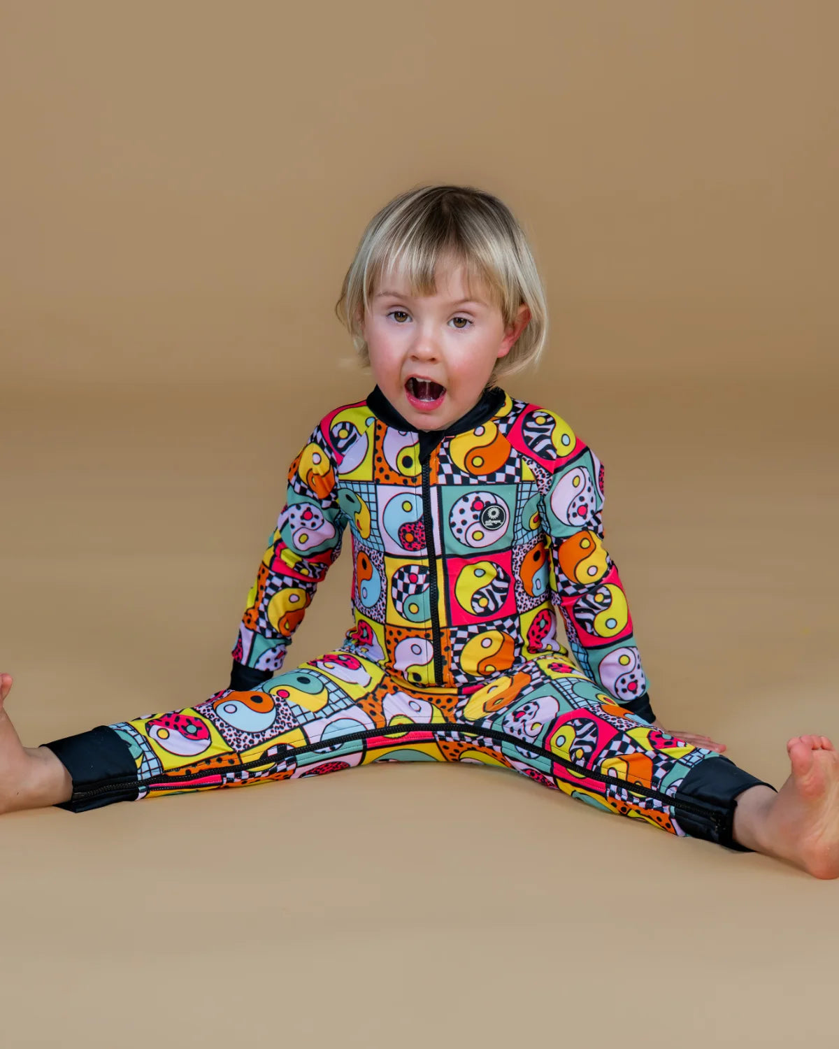Yin Yang Yeah! baby sunsuit, photo 2 – bright UPF50+ long sleeve swimsuit by Cucumber Cool