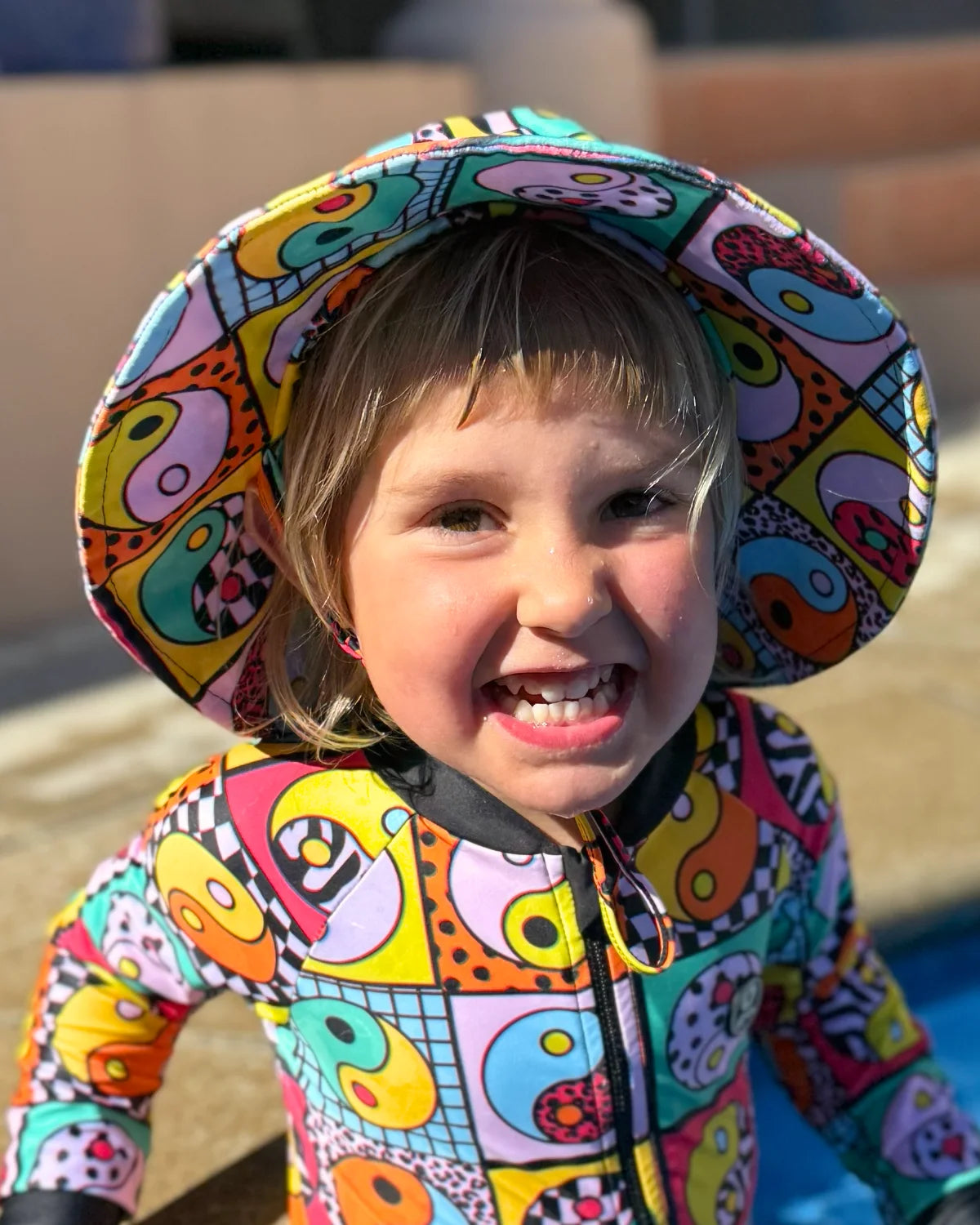 Yin Yang Yeah! kids swim bucket hat with chin strap, photo 5 – bright UPF50+ round brim beach hat by Cucumber Cool