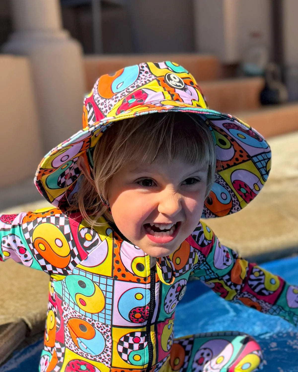 Yin Yang Yeah! kids swim bucket hat with chin strap, photo 4 – bright UPF50+ round brim beach hat by Cucumber Cool