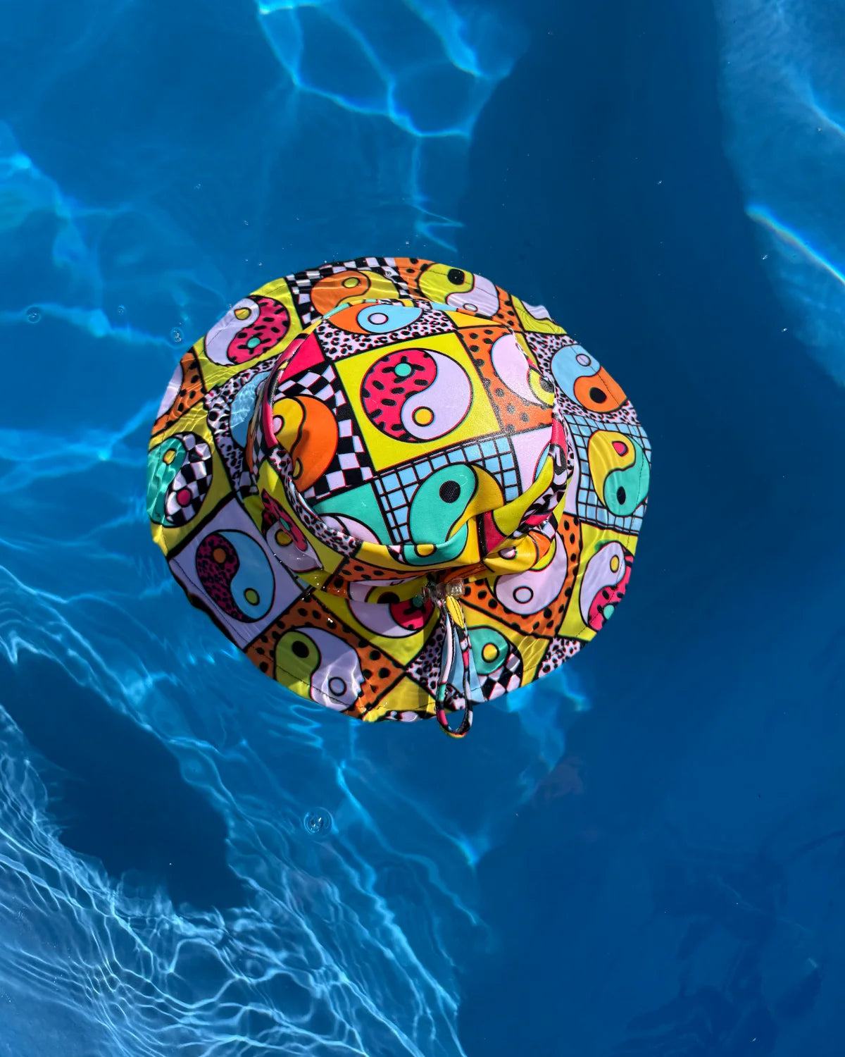 Yin Yang Yeah! kids swim bucket hat with chin strap, photo 3 – bright UPF50+ round brim beach hat by Cucumber Cool