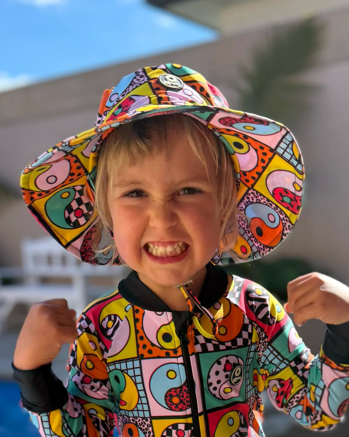 Yin Yang Yeah! kids swim bucket hat with chin strap – bright UPF50+ round brim beach hat by Cucumber Cool